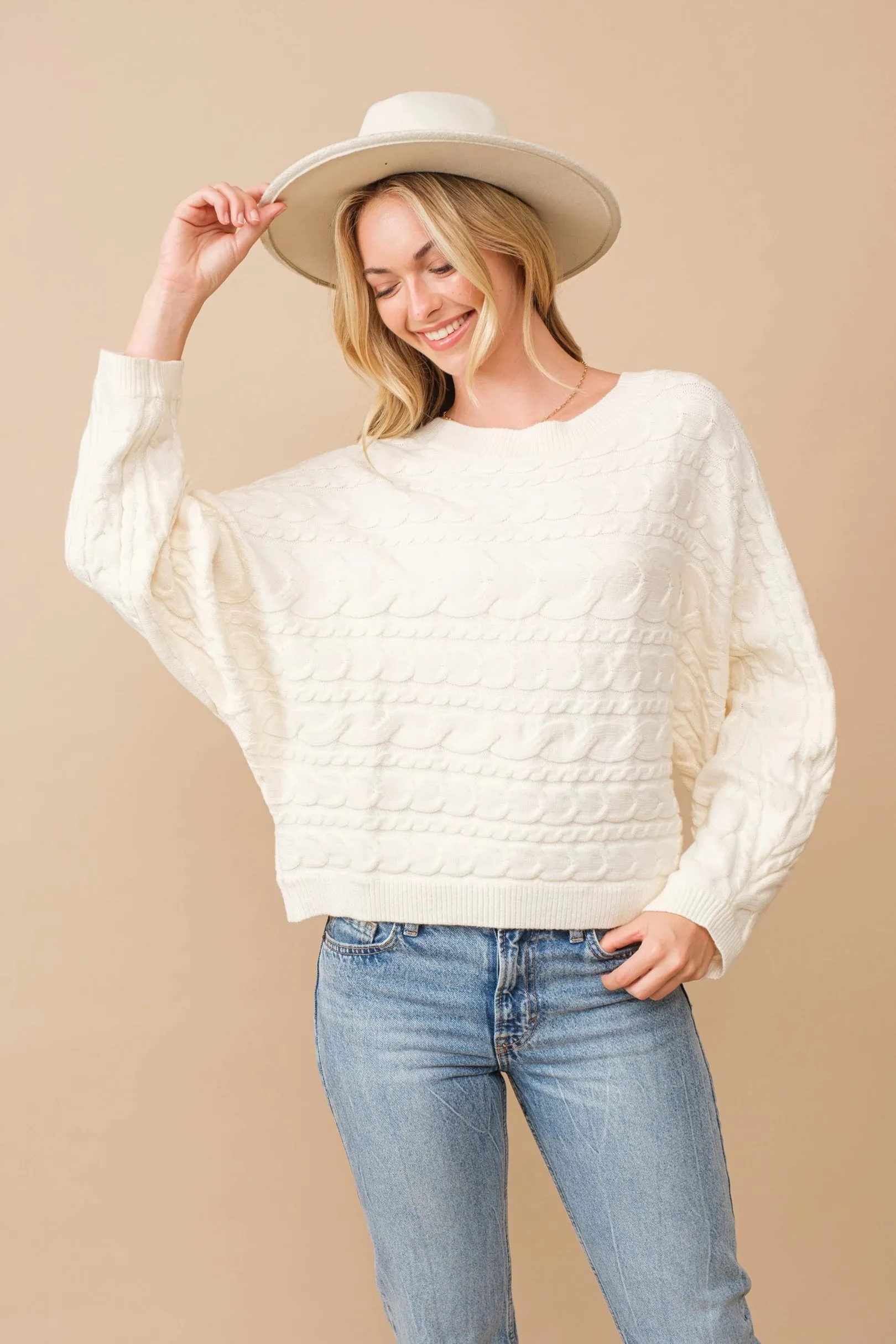 Horizontal cable knit dolman sleeve sweater